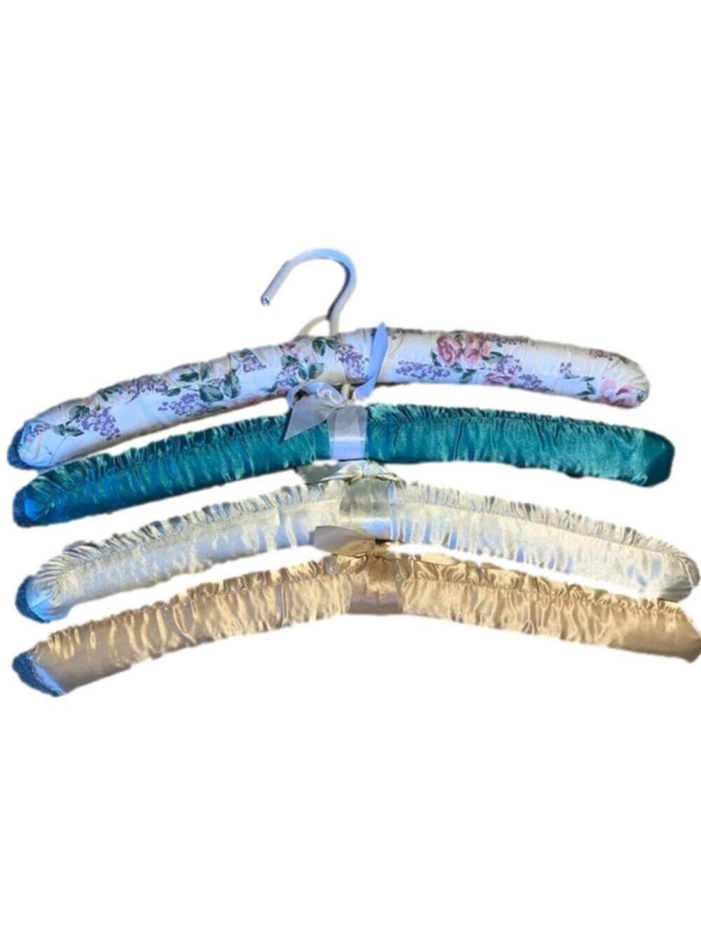 Four fabric covered hangers